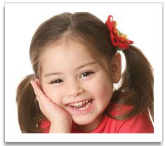 Smiling young girl in pigtails